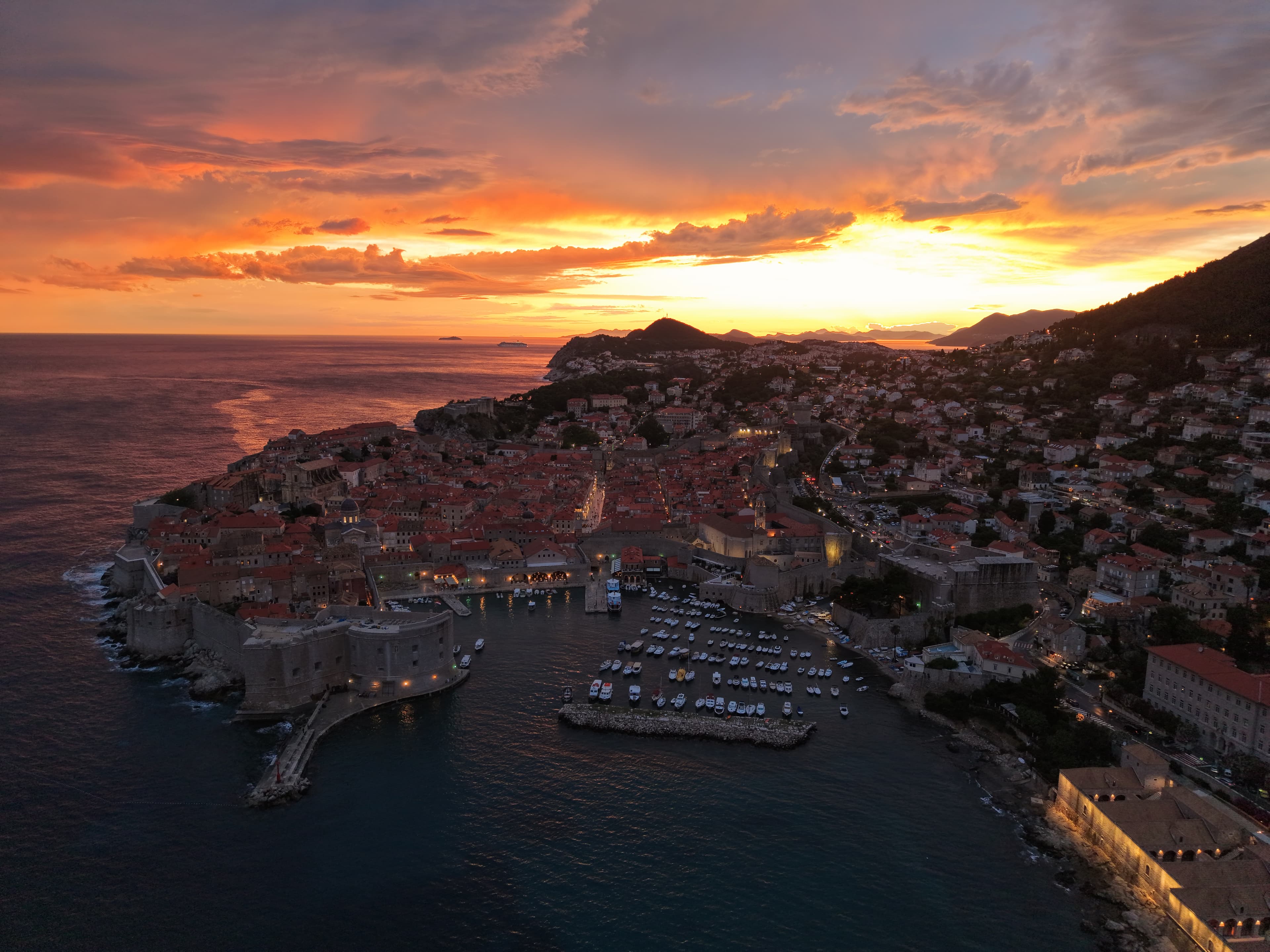 Fiery sunset over Dubrovnik Old Town from the air